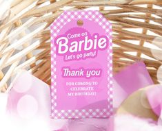 a pink tag that says,'come on barbie let's go party thank you for coming to celebrate my birthday '