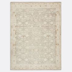 a beige rug with an intricate design on the top and bottom, in front of a white background