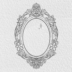 an ornate oval frame with flowers and leaves