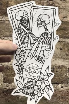 a sticker with two skeletons holding hands in front of a brick wall and flowers