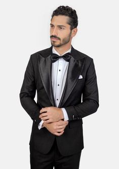 Crafted from a luxurious sharkskin weave wool, the Liberty Black Tuxedo is a sophisticated, statement-making formalwear option. Wide peak lapels in a single button configuration stand out from typical tuxedo styles. Dress to impress with this high-end, premium garment – a modern blend of elegance and refinement. Elegant Black Single-breasted Tuxedo, Tuxedo Blazer For Black-tie Gala Events, Custom Fit Tuxedo Blazer For Black-tie Events, Black Tuxedo With Hidden Button Closure And Lapel Collar, Elegant Black Tuxedo With Lapel Collar, Black Single Breasted Tuxedo For Formal Occasions, Formal Black Single Breasted Tuxedo, Classic Black Tuxedo With Lapel Collar, Black Tuxedo With Lapel Collar