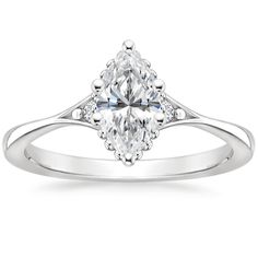 an engagement ring with a pear shaped diamond