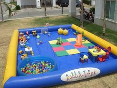 an inflatable play area with toys on the ground