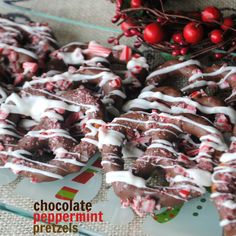 chocolate peppermint pretzels with white icing on a glass platter