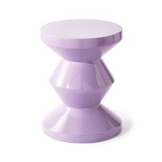 a purple stool sitting on top of a white floor