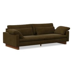 a brown couch sitting on top of a white floor