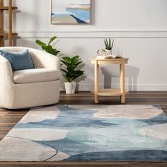 a living room with a chair, table and rug