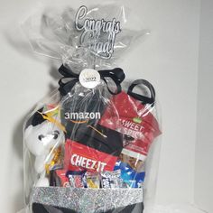 a gift basket filled with candy, snacks and other items for someone's birthday