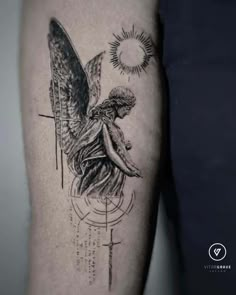 an angel tattoo on the arm