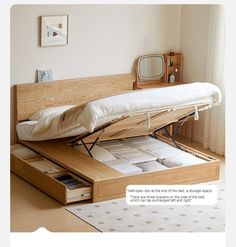 a bed that has been opened and is sitting on top of a table with drawers underneath it