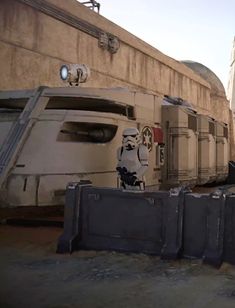 a scene from the video game star wars with stormtroopers and vehicles in the background