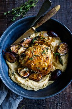 a blue bowl filled with mashed potatoes and chicken