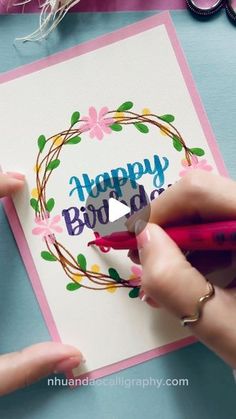 someone is making a happy birthday card with scissors