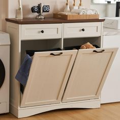 PRICES MAY VARY. High Quality: 39.76"L x 13.58"W x 38.58"H trash can cabinet (trash can not included). Made of MDF, the tilt out trash cabinet which fits up to 2 x 13 gallon trash can. You can put microwave, coffee maker or anything you want on the tabletop. Multifunctional Design: The trash cabinet is not only a practical kitchen trash can but it can also be used as the laundry basket or recycling bin, as well as a pet food bin. The drawers provide the convenient storage space for small sundries. Modern Trash Cabinet: Tilt out trash cabinet is simple and practical. It can be easily incorporated into a variety of decorating styles. It will be perfect for dressing up your kitchen, home, apartment, dorm room, etc. It also can be used as a kitchen island or suitable to store dog food, cat foo Double Garbage Cabinet, Laundry Cabinet Tilt, Trash Cabinet Hardware, Kitchen Towel Bin, Ikea Recycle Bin Hack, Trash Can Storage Kitchen Pull Out, Kitchen Trash Can Cabinet The Home Depot, Tilt Out Garbage Can Storage Kitchen, Cabinet With Trash