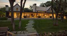 Inside this cottage style retreat with a serene backdrop of Lake Okoboji Okoboji Iowa, Houses Styles, Mountain Farm, Modular Housing, Lakefront Homes