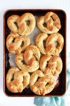 freshly baked pretzels on a baking tray ready to be eaten for lunch or dessert