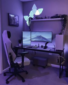 a computer desk with two monitors and a chair in front of it, lit up by blue lights