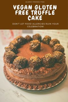 a cake with chocolate frosting and nuts on top that reads vegan gluten freetruffle cake don't let food alleries ruin your celebration