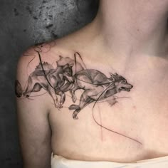 a woman's chest with some animals on it