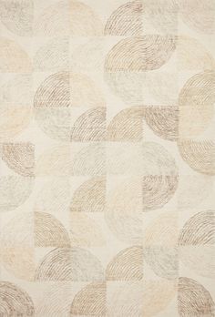 a beige rug with circles on it