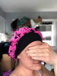 a woman covering her eyes with one hand