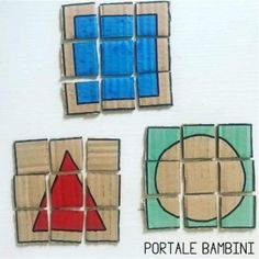 three pieces of wood with different shapes and colors on them, one is blue, the other is red