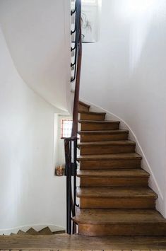 the stairs are made of wood and have metal handrails