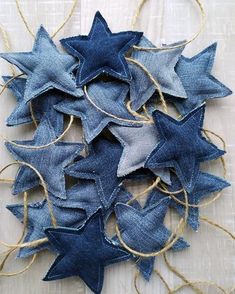 several blue stars are hanging from twine