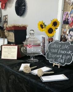 a table topped with lots of different types of items and decorations on top of it