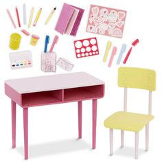 a toy desk and chair are shown in this image, with supplies on the table