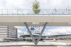 an elevated walkway in front of a large building