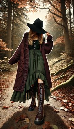 Embrace the magic of the season with this cozy, witchy fall outfit—perfect for grounding rituals and autumn nature walks. Layer up with a deep burgundy knit cardigan and a flowing green dress, paired with leather boots for exploring the forest. This look blends style with spiritual intention, helping you stay warm and grounded as you connect with the earth. Add a touch of mysticism with a wide-brimmed hat and a pentagram pendant. Follow for more mystical, empowering style tips! #WitchyFashion #FallOutfits #GroundingRituals #AutumnVibes Herbology Aesthetic Outfit, Green Cardigan Outfit Winter, Irish Outfits Women, Herbalist Outfit, Witchy Outfits Fall, Green Witch Aesthetic Fashion, Casual Witch Outfit, Witchy Outfit Ideas, Fall Witchy Outfits