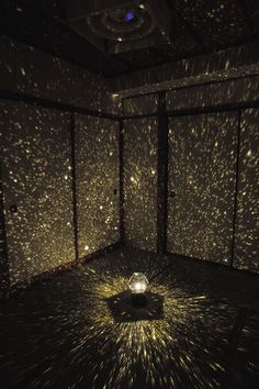 a room filled with lots of lights and stars on the wall next to each other