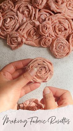 someone is making fabric roses with their hands