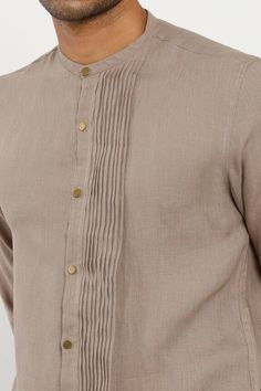 Stone slim-fit kurta with pleated panel, mandarin collar and cuff button placket. Component: 1 Neckline: Mandarin Sleeve Length: Full Fabric: 100% Linen Color: Brown Cuff button placket Note: Pant worn by the model is not for sale - Aza Fashions Linen Kurta For Men, Kurta Designs Men's, Short Kurtas, Wedding Kurta For Men, Wedding Kurta, Mandarin Collar Shirt, Kurta Men