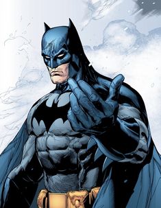 the batman is standing with his fist up in front of him and pointing at something