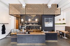 two pictures of the inside of a coffee shop, one with an open counter and another with food on it