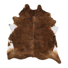 a brown and white cowhide rug on a white background