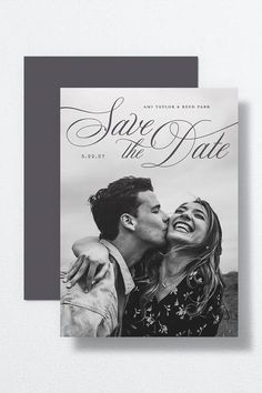 a save the date card with an image of a couple kissing and holding each other