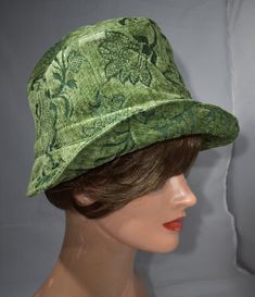 "aI made this  hat  from high end jacquard cotton and rayon chenille fabric of good construction. This hat measures 25 5/8 inches in circumference and is a size Xlarge.My hats look good on all types of hair styles.   Some people wear the hats and headbands high on their head and above the ears; others wear them low on the head and over the tips of the ears. They look great both ways.  21 ½\" - < 22 ½\" is small  22 ½\" - <23 ½\" is medium  23 ½ - <25 is large Measure your head:   Use a tape measure to determine the length, or size in inches. Place the   tape around your head about 1/8\" above your ear, across the mid-forehead, completely circling your head. You may want to measure a little bit over your ear if there is a deeper crown to the hat, or if you are wanting to keep your ears warm Green Cotton Hat With Short Brim, Green Cotton Bucket Hat One Size, Green Wide Brim Bucket Hat, Fitted Cotton Hat With Flat Brim, Green Sun Hat With Curved Brim, Green Flat Brim Hat, One Size Fits Most, Green Cotton Spring Hat, Green Wide Brim Cotton Sun Hat, Green Cotton Wide Brim Bucket Hat