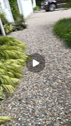 an image of a driveway with gravel and grass