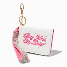 a pink and white purse with a key chain attached to it