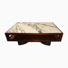 a marble top coffee table with black legs and wooden base, against a white background