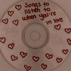 a cd with hearts and words written on it