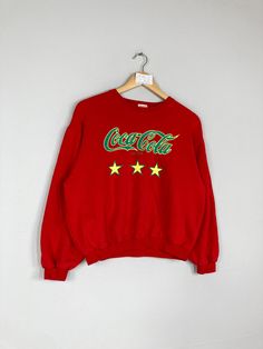 Vintage Rare COCA COLA Women Cropped Crewneck Sweatshirt Big Logo Coca Cola Jumper Pullover Coca Cola Sweater Red Colour Large Size CONDITION :- ✅GOODUSED CONDITION. ✅NO STAINS  ✅NO HOLE ITEM DESCRIPTION:- ✅SIZE: 160 ✅MATERIAL : COTTON ✅THIS USED & VINTAGE ITEMS, SO DON'T EXPECTED IT TO BE LIKE NEW CONDITION!! MEASUREMENT: ✅ARMPIT TO ARMPIT : 21.5 INCH ✅LENGHT NECK TO : 20.5 INCH  ✅SHOULDHER : 21 INCH ✅SLEEVE: 18.5 INCH PLEASE REFER PHOTO BEFORE ORDER √ALL MEASUREMENTS ARE TAKEN WITH THE GARMENT FLAT ON THE GROUND √WE SHIP BY POST VIA MALAYSIA INTERNATIONAL REGISTERED/SIGNED FOR WITH TRACKING NO. TRACKING NUMBER WILL BE GIVEN. √THE PARCEL WILL BE ARRIVE WITHIN 10-14 WORKING DAYS OR MORE DUE TO THE LOCATION & CUSTOMS CLEARINGS. √BUYER DON'T HESITATE TO ASK ME IF ANY INQUIRY ABOUT ITEM BEFOR Red Vintage Crew Sweater, Vintage Red Crew Neck Sweater, Retro Red Long Sleeve Sweatshirt, Red Retro Long Sleeve Sweatshirt, Red Retro Winter Tops, Retro Red Tops For Winter, Vintage Red Long Sleeve Sweatshirt, Red Vintage Long Sleeve Sweatshirt, Red Cotton Crew Neck Sweater