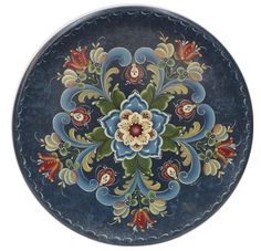 a blue plate with an ornate design on it