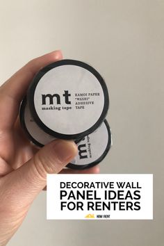 a hand holding two magnets with the words decorative wall panel ideas for renters