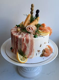 there is a cake that has been decorated with fruits and vegetables on top of it