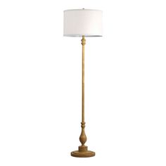 a floor lamp with a white shade on the base and a wooden pole at the bottom