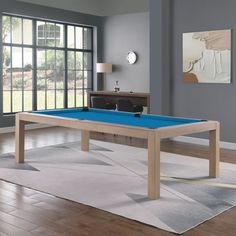 a blue pool table in a living room